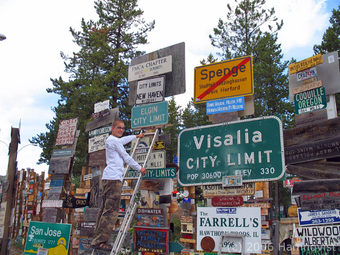 Erik poses next to our tiny sign