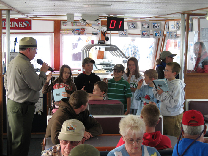 Karl being sworn in as a Kenai Fjords Junior Park Ranger by an official Park Ranger