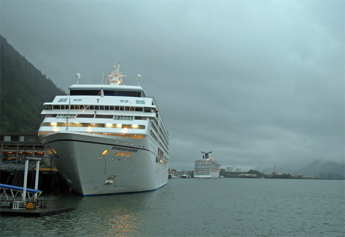 Two cruise ships sit in the port of Juneau, just outside the window of our restaurant
