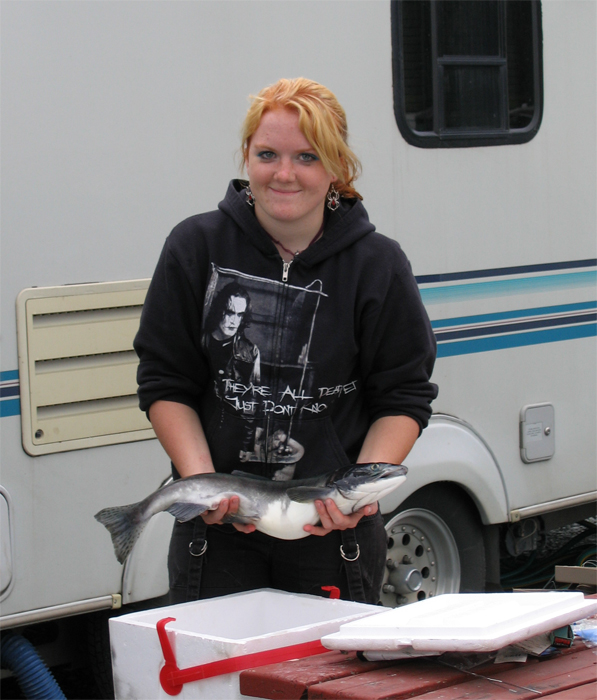 Isabella shows off a nice salmon they snagged