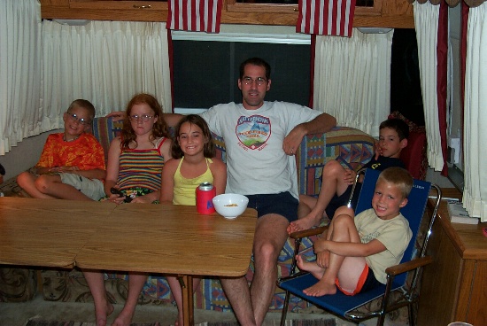 Watching TV inside the trailer before dinner