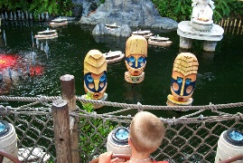 Erik driving a boat near jungle boat ride