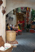 Preparing a Venetian style mask in Morroccan pavilion