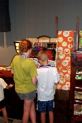 Looking at different and very nice chopsticks in the Japanese pavilion
