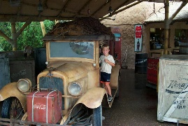 Karl posing by a Coca Cola car