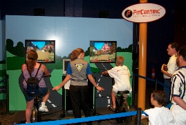 Erik trying out an interactive bicycle race game